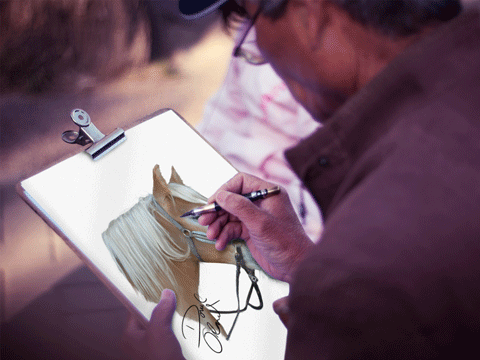 the artist at work on a horse portrait commission